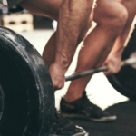 two men doing deadlifts side by side.